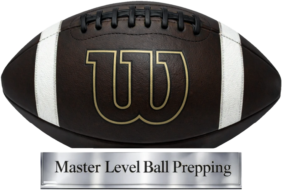 A leather football on a stand, with a plaque reading Master Level Ball Prepping
